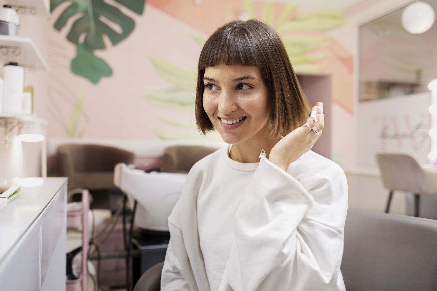 woman-getting-treatment-hairdresser-shop